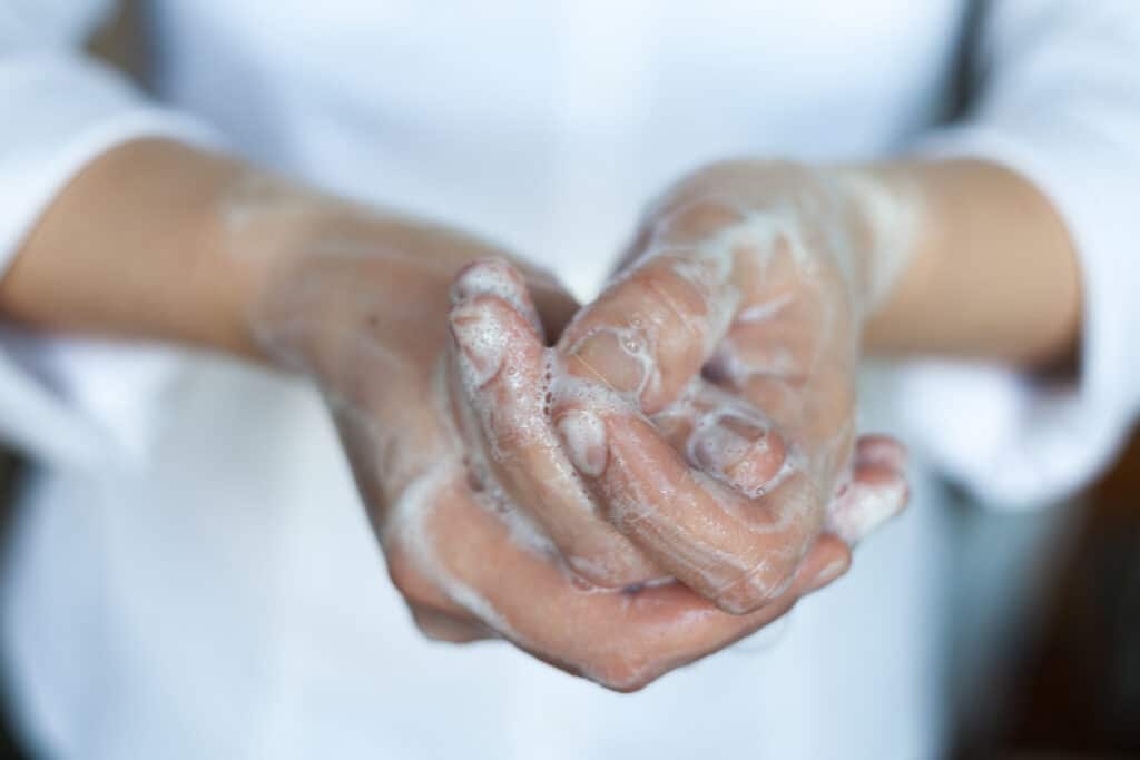 Picture of a woman washing her hands.