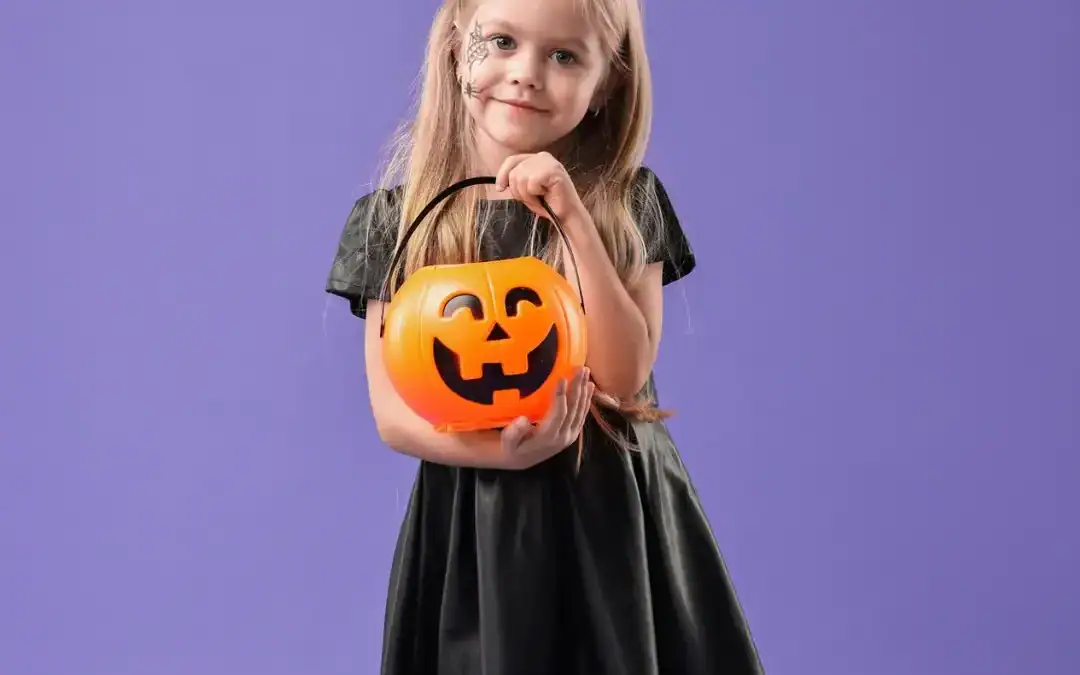 happy girl with pumpkins