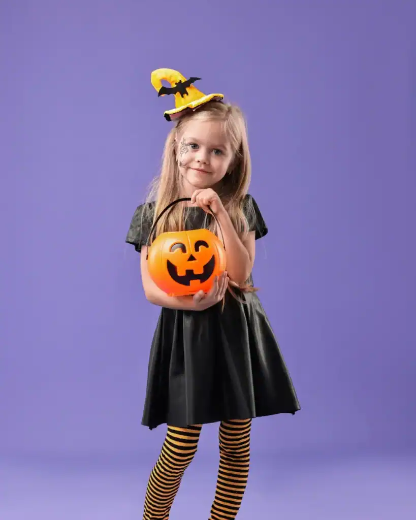 happy girl with pumpkins